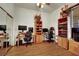 Hardwood floor of office furnished with two desks, multiple monitors, and natural lighting at 9142 Royal Monarch Ct, Las Vegas, NV 89147