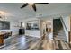 Dining area with stylish lighting, a chalkboard wall, and stairs leading to upper level at 100 Huntly Rd, Las Vegas, NV 89145
