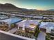 Aerial view showcasing a luxury home, its private backyard with a pool, and the surrounding neighborhood at 10048 Copper Edge Rd, Las Vegas, NV 89148