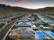 Gorgeous aerial view of homes and community against the desert mountain backdrop at 10048 Copper Edge Rd, Las Vegas, NV 89148