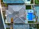 Aerial of luxury home highlighting roof, backyard pool and spa with manicured landscaping, and outdoor living at 10048 Copper Edge Rd, Las Vegas, NV 89148
