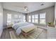 Bright bedroom featuring neutral tones, plantation shutters, and a ceiling fan for added comfort at 10048 Copper Edge Rd, Las Vegas, NV 89148
