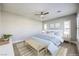 Spacious bedroom with neutral decor, ceiling fan, and ample natural light at 10048 Copper Edge Rd, Las Vegas, NV 89148