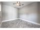 Unfurnished bedroom showcasing a ceiling fan and unique herringbone wood flooring at 10048 Copper Edge Rd, Las Vegas, NV 89148