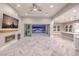 Spacious living room with a fireplace and sliding glass doors leading to the pool at 10048 Copper Edge Rd, Las Vegas, NV 89148