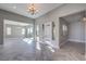 Bright living area featuring herringbone floors, large windows, and sliding glass doors for natural light at 10048 Copper Edge Rd, Las Vegas, NV 89148