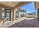 Covered patio with brick pavers and views of the backyard, great for entertaining at 10048 Copper Edge Rd, Las Vegas, NV 89148