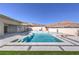 Stunning backyard pool and spa featuring a waterfall and modern design with desert mountain views at 10048 Copper Edge Rd, Las Vegas, NV 89148
