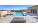 Beautiful backyard pool with spa and fire pit, offering a luxurious outdoor living space at 10048 Copper Edge Rd, Las Vegas, NV 89148