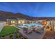 Inviting backyard oasis with a pristine pool, outdoor seating, and mountain views at 10048 Copper Edge Rd, Las Vegas, NV 89148