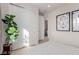 Bright bedroom featuring a large window, stylish submarine prints and sliding door closet at 10316 Apefly St, Las Vegas, NV 89141