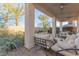 Inviting covered patio with comfortable seating and views of the landscaped backyard at 10316 Apefly St, Las Vegas, NV 89141