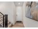 Light and airy entry foyer with stairs, ceramic tile floor, and white door at 10316 Apefly St, Las Vegas, NV 89141