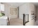 Upstairs hallway with decorator wall art and horizontal railing at 10316 Apefly St, Las Vegas, NV 89141