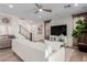Bright living room featuring stylish furnishings, wood-look flooring, and a modern ceiling fan at 10316 Apefly St, Las Vegas, NV 89141