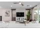 Bright living area with modern decor, comfortable seating, and stylish curtains in an open-concept layout at 10316 Apefly St, Las Vegas, NV 89141