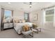 Spacious main bedroom boasts neutral color palette, plush carpeting and ample natural light at 10316 Apefly St, Las Vegas, NV 89141