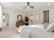 Spacious main bedroom boasts neutral color palette, plush carpeting and ample natural light at 10316 Apefly St, Las Vegas, NV 89141
