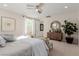 Spacious main bedroom boasts neutral color palette, plush carpeting and ample natural light at 10316 Apefly St, Las Vegas, NV 89141