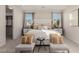 Spacious main bedroom boasts neutral color palette, plush carpeting and ample natural light at 10316 Apefly St, Las Vegas, NV 89141