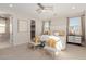 Spacious main bedroom boasts neutral color palette, plush carpeting and ample natural light at 10316 Apefly St, Las Vegas, NV 89141