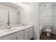 Bathroom features double sinks, quartz counters, and wood-look tile flooring at 10328 Apefly St, Las Vegas, NV 89141