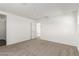 Carpeted bedroom with neutral walls and access to another room at 10328 Apefly St, Las Vegas, NV 89141