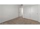 Bedroom with neutral carpet and closet with double doors at 10328 Apefly St, Las Vegas, NV 89141