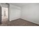 Bedroom with neutral carpet and sliding closet doors at 10328 Apefly St, Las Vegas, NV 89141