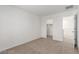 Bedroom showing neutral carpet and access to the walk-in closet and hallway at 10328 Apefly St, Las Vegas, NV 89141