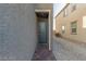 Exterior side entrance features a brick walkway and a view of the side yard at 10328 Apefly St, Las Vegas, NV 89141