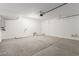 Well-lit two-car garage with high ceilings, providing ample space for vehicles and projects at 10328 Apefly St, Las Vegas, NV 89141