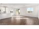 Bright, open living space with wood-look floors and a modern kitchen at 10328 Apefly St, Las Vegas, NV 89141