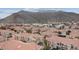 A high-angle showcases an aerial view of the property with mountains in the background at 10550 W Alexander Rd # 2082, Las Vegas, NV 89129