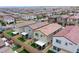 Birds-eye view of the homes featuring private backyards and the city skyline in the distance at 10590 Dryades Ave, Las Vegas, NV 89166
