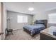Cozy bedroom with plush carpeting and a large window at 10590 Dryades Ave, Las Vegas, NV 89166