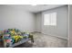 Neutral bedroom with carpet and window, offers a clean slate to personalize as your own at 10590 Dryades Ave, Las Vegas, NV 89166