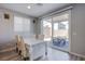 Bright dining area with sliding glass doors leading to an outdoor patio at 10590 Dryades Ave, Las Vegas, NV 89166