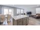 Modern kitchen with a large island, stainless appliances and an open layout to the living space at 10590 Dryades Ave, Las Vegas, NV 89166