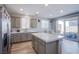 Well-appointed kitchen with an island, lots of counter space, and access to the outdoor patio at 10590 Dryades Ave, Las Vegas, NV 89166