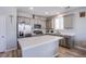 Modern kitchen featuring stainless steel appliances, quartz countertops, and a center island at 10590 Dryades Ave, Las Vegas, NV 89166