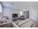 Comfortable living room with plush seating and a large TV at 10590 Dryades Ave, Las Vegas, NV 89166