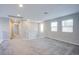 Inviting loft space with neutral colors and plenty of natural light from large windows at 10590 Dryades Ave, Las Vegas, NV 89166
