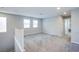 Spacious upstairs loft area with plush carpet and natural light at 10590 Dryades Ave, Las Vegas, NV 89166