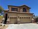 Charming two-story home with a tile roof, stone accents, and a two-car garage at 10601 Turquoise Valley Dr, Las Vegas, NV 89144