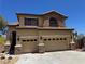 Attractive two-story home with a tile roof, stone detailing, and a well-maintained front yard at 10601 Turquoise Valley Dr, Las Vegas, NV 89144