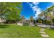 Well-manicured backyard with a serene pool and spa area surrounded by lush landscaping and a stone walkway at 10761 Capesthorne Way, Las Vegas, NV 89135