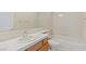 Bright bathroom features a tiled countertop and tub-shower combo at 10761 Capesthorne Way, Las Vegas, NV 89135