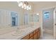 Bathroom with double sinks and a combined shower and tub at 10761 Capesthorne Way, Las Vegas, NV 89135