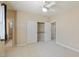 Carpeted bedroom with a double closet and an ensuite bathroom at 10761 Capesthorne Way, Las Vegas, NV 89135